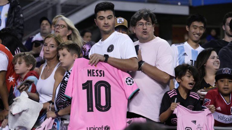 Fans wait, hoping to get an autograph from Inter Miami forward Lionel Messi before the team's MLS soccer match against the Chicago Fire in Chicago, Wednesday, Oct. 4, 2023. (Nam Y. Huh/AP)