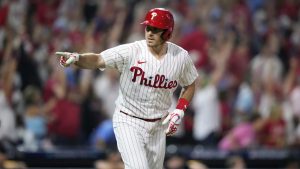Philadelphia Phillies' J.T. Realmuto reacts after hitting a home run against Miami Marlins pitcher David Robertson during the fourth inning of Game 2 in an NL wild-card baseball playoff series, Wednesday, Oct. 4, 2023, in Philadelphia. (Matt Slocum/AP)