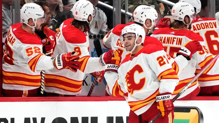 Calgary Flames' Matt Coronato (27) is congratulated for his goal against the Pittsburgh Penguins during the second period of an NHL hockey game in Pittsburgh, Saturday, Oct. 14, 2023. (Gene J. Puskar/AP)
