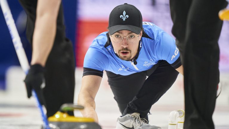Quebec skip Félix Asselin watches his shot during his match against P.E.I. at the 2023 Tim Hortons Brier at Budweiser Gardens in London, Ont., Sunday, March 5, 2023. Canada improved to 7-0 and clinched a quarterfinal spot at the world mixed doubles curling championship with a 7-5 win over Slovenia on Wednesday. (Geoff Robins/CP)