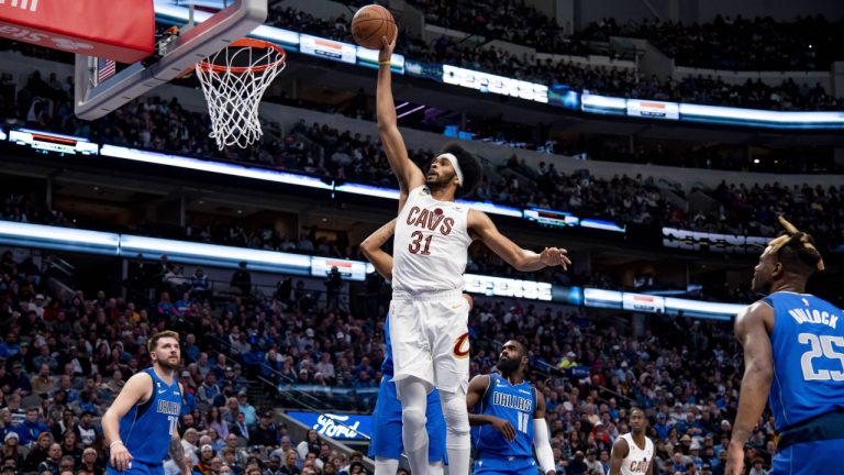 Cleveland Cavaliers centre Jarrett Allen (31) leaps in the air to dunk the ball in the second half of an NBA basketball game against the Dallas Mavericks in Dallas, Wednesday, Dec. 14, 2022. (Emil Lippe/AP)