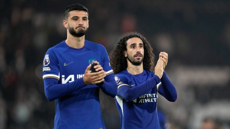 Chelsea's Armando Broja, left, and Chelsea's Marc Cucurella celebrate their victory at the English Premier League soccer match between Fulham and Chelsea. (Kin Cheung/AP)