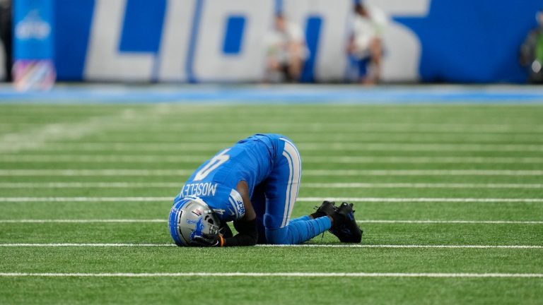 Detroit Lions cornerback Emmanuel Moseley (4) lies in the turf after being injured in the first half of an NFL football game against the Carolina Panthers in Detroit, Sunday, Oct. 8, 2023. (Paul Sancya/AP)
