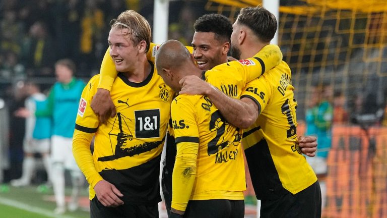 Dortmund's Julian Brandt, left, is congratulated after scoring the opening goal during the German Bundesliga soccer match between Borussia Dortmund and Werder Bremen. (Martin Meissner/AP)