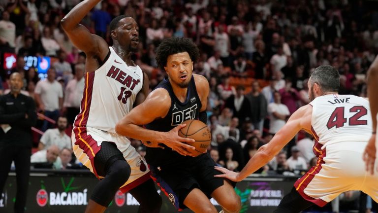 Detroit Pistons guard Cade Cunningham drives to the basket as Miami Heat centre Bam Adebayo and forward Kevin Love defend, during the second half of an NBA basketball game, Wednesday, Oct. 25, 2023, in Miami. (Marta Lavandier/AP Photo)