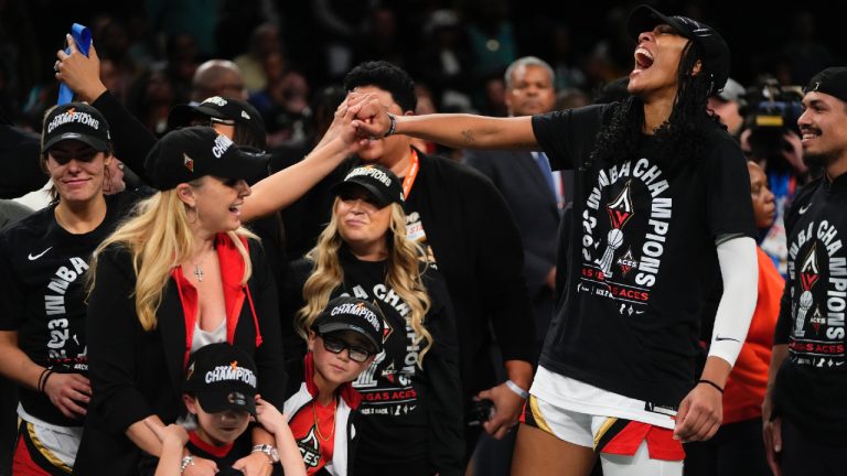 Las Vegas Aces' A'ja Wilson, right, celebrates with teammates after Game 4 of a WNBA basketball final playoff series against the New York Liberty Wednesday, Oct. 18, 2023, in New York. The Aces won 70-69. (Frank Franklin II/AP)