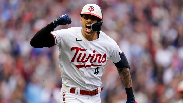 Minnesota Twins' Carlos Correa reacts after hitting an RBI single during the fourth inning of Game 2 of an AL wild-card baseball playoff series against the Toronto Blue Jays Wednesday, Oct. 4, 2023, in Minneapolis. (AP)