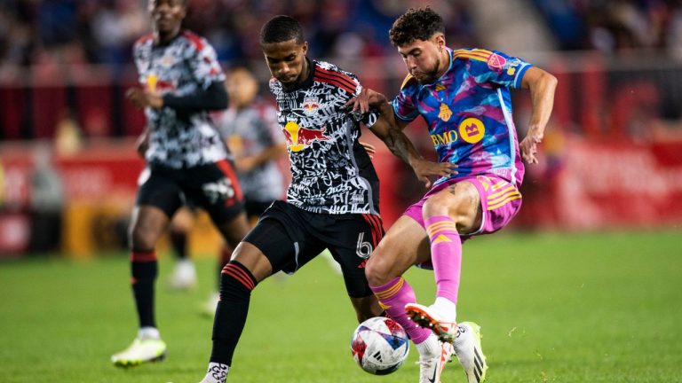 Toronto FC midfielder Jonathan Osorio vies for the ball against New York Red Bulls defender Kyle Duncan during an MLS soccer match Saturday, Oct. 7, 2023, in Harrison, N.J. (Eduardo Munoz Alvarez/AP Photo)