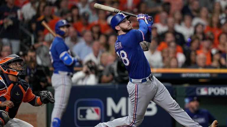 Texas Rangers' Jonah Heim hits a two-run home run during the fourth inning of Game 6 of the baseball AL Championship Series against the Houston Astros Sunday, Oct. 22, 2023, in Houston. (David J. Phillip/AP)