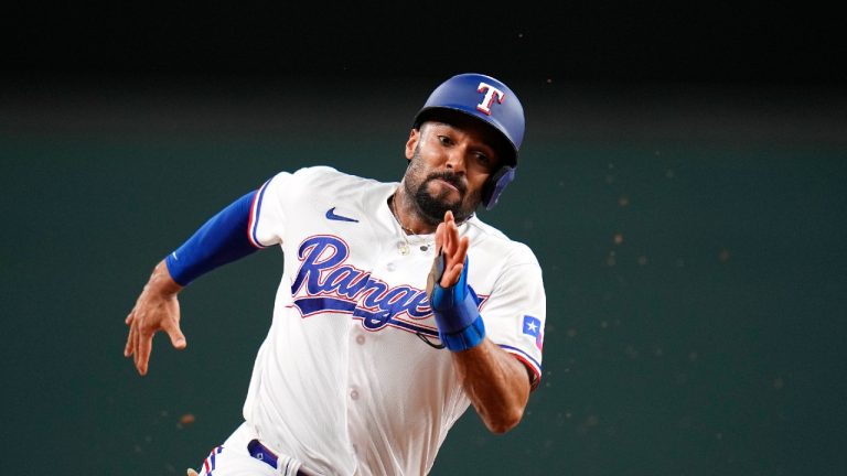 Texas Rangers' Marcus Semien runs the bases during Game 3 of the baseball American League Championship Series against the Houston AstrosWednesday, Oct. 18, 2023, in Arlington, Texas. (Julio Cortez/AP)