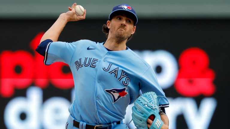 Toronto Blue Jays starting pitcher Kevin Gausman throws to a Minnesota Twins batter during the first inning in Game 1 of an AL wild-card baseball playoff series Tuesday, Oct. 3, 2023, in Minneapolis. (Bruce Kluckhohn/AP)