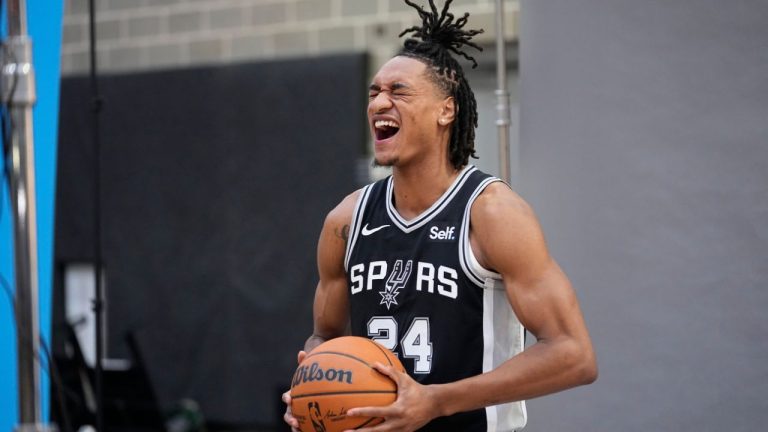 San Antonio Spurs guard Devin Vassell (24) poses for photos during an NBA basketball media day in San Antonio, Monday, Oct. 2, 2023. (Eric Gay/AP Photo)
