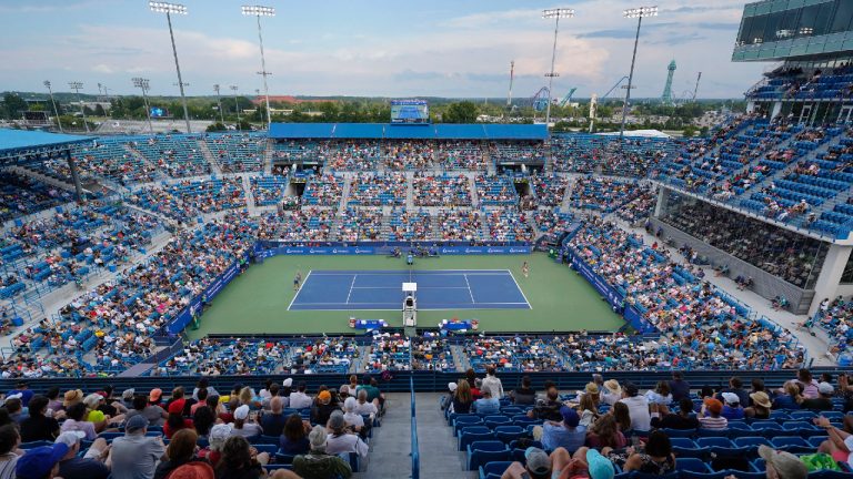 Borna Coric, left, of Croatia, serves to Stefanos Tsitsipas, of Greece, during the men's singles final of the Western & Southern Open tennis tournament Sunday, Aug. 21, 2022, in Mason, Ohio. (Jeff Dean/AP)