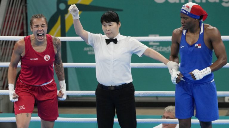 Canadian boxer Tammara Thibeault, left, celebrates her victory over Panama's Atheyna Bylon after their middleweight gold medal bout at the Pan Am Games in Santiago, Chile on Friday, Oct. 27, 2023. (Frank Gunn/CP)