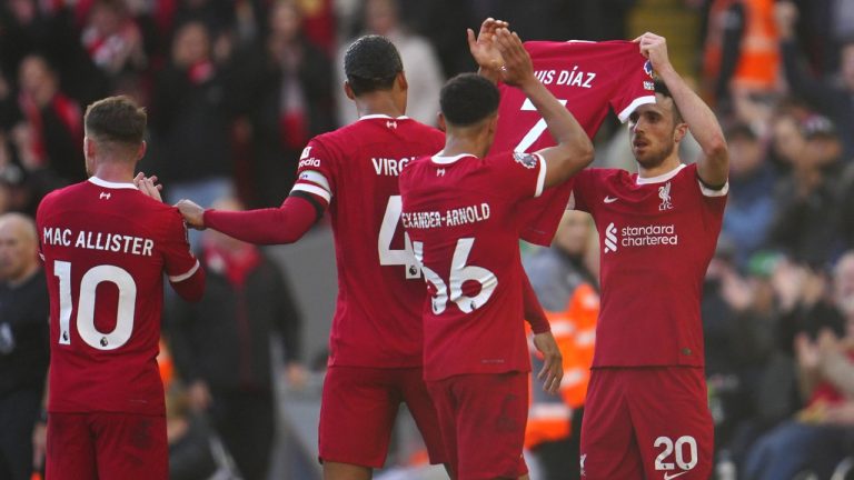 Liverpool's Diogo Jota celebrates after scoring his side's opening goal holding the jersey of teammate Luis Diaz during the English Premier League soccer match between Liverpool and Nottingham Forest, at Anfield in Liverpool, England, Sunday, Oct. 29, 2023. (Jon Super/AP)