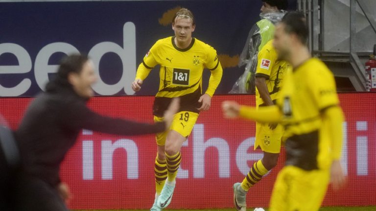 Dortmund's Julian Brandt celebrates his side's equalising goal during a German Bundesliga soccer match between Eintracht Frankfurt and Borussia Dortmund in Frankfurt, Germany, Sunday, Oct. 29, 2023. (Michael Probst/AP)
