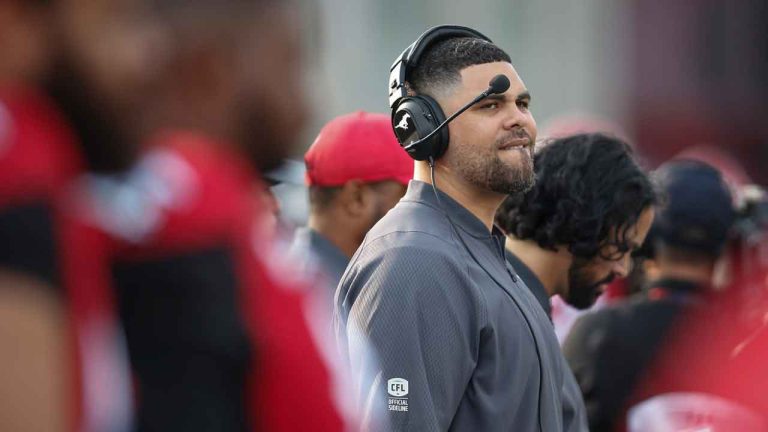 Corey Mace takes to the field during CFL pre-season football action in Calgary. (Jeff McIntosh/THE CANADIAN PRESS)
