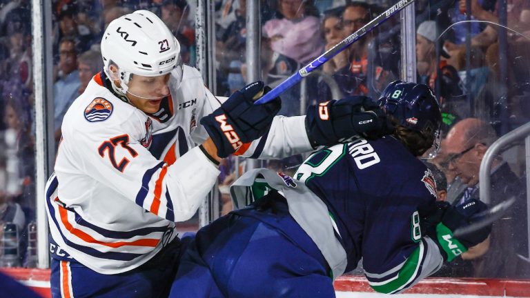 Seattle Thunderbirds defenceman Bryce Pickford, right, is checked by Kamloops Blazers forward Jakub Demek during third period Memorial Cup hockey action in Kamloops, Wednesday, May 31, 2023. (Jeff McIntosh/CP)