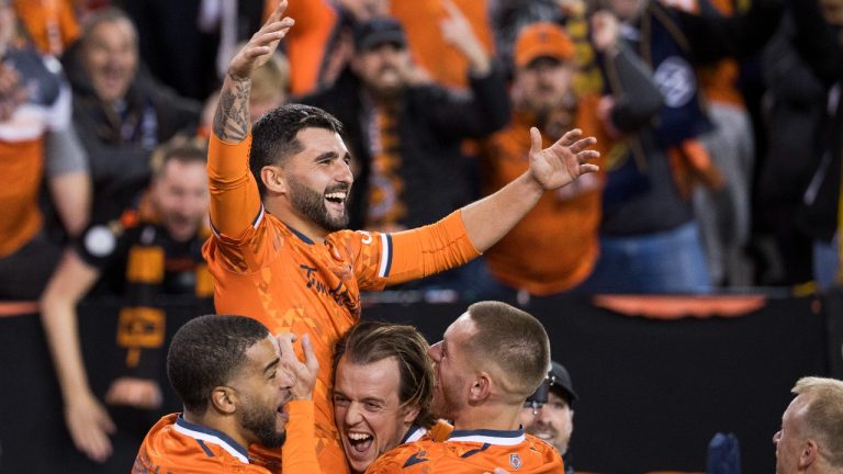 Forge FC teammates lift up Tristan Borges (19) following his goal against Cavalry FC in extra time during Canadian Premier League finals soccer action in Hamilton on Saturday, Oct. 28, 2023. (Nick Iwanyshyn/THE CANADIAN PRESS)