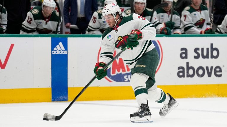 Minnesota Wild right wing Ryan Hartman takes a shot during Game 5 of an NHL hockey Stanley Cup first-round playoff series against the Dallas Stars, Tuesday, April 25, 2023, in Dallas. (Tony Gutierrez/AP)