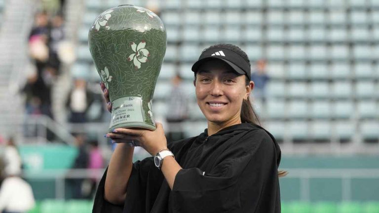 Jessica Pegula of the United States holds up her winning trophy after defeating Yue Yuan of China in their final match of the Korea Open tennis championships in Seoul, South Korea. (Ahn Young-joon/AP)