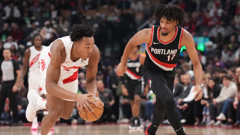 Toronto Raptors forward Scottie Barnes (4) grabs a loose ball as Portland Trail Blazers guard Shaedon Sharpe (17) defends during first half NBA basketball action. (Nathan Denette/CP)