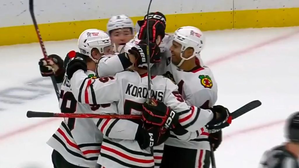 Blackhawks’ Kevin Korchinski gets the tipin off Raddysh’s skate for