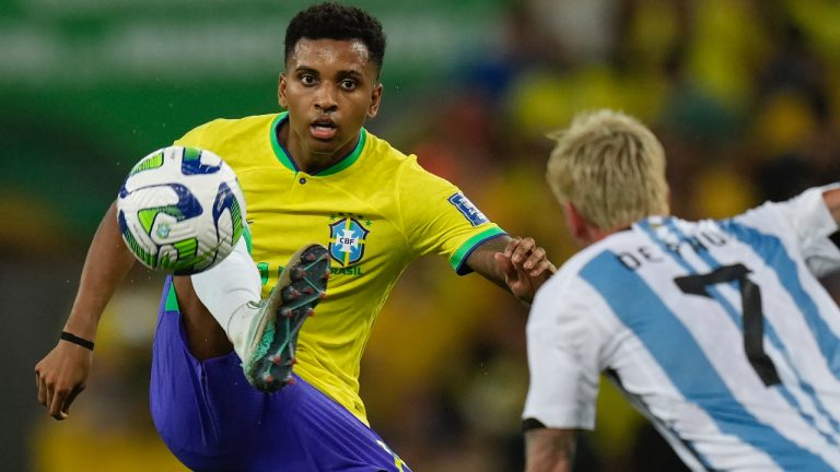 Brazil's Rodrygo controls the ball challenged by Argentina's Rodrigo De Paul during a qualifying soccer match for the FIFA World Cup 2026 at Maracana stadium in Rio de Janeiro, Brazil, Tuesday, Nov. 21, 2023. (Silvia Izquierdo/AP)