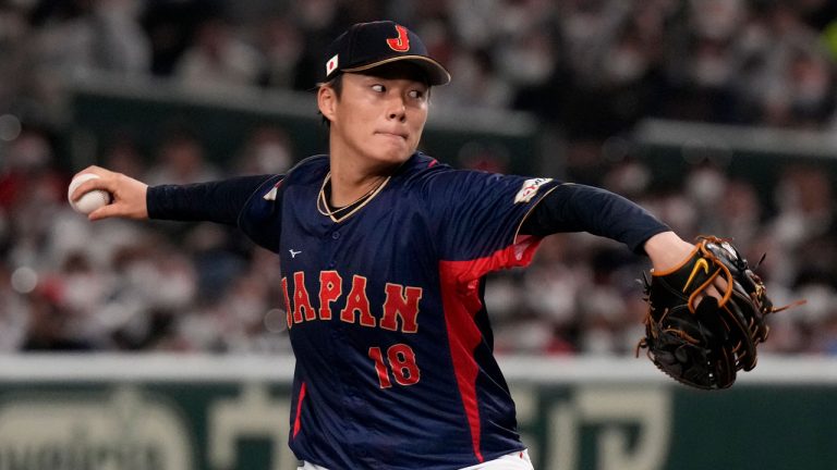 Yoshinobu Yamamoto of Japan pitches to Australia win the 1rst inning during their Pool B game at the World Baseball Classic at the Tokyo Dome Sunday, March 12, 2023, in Tokyo. (Eugene Hoshiko/AP)