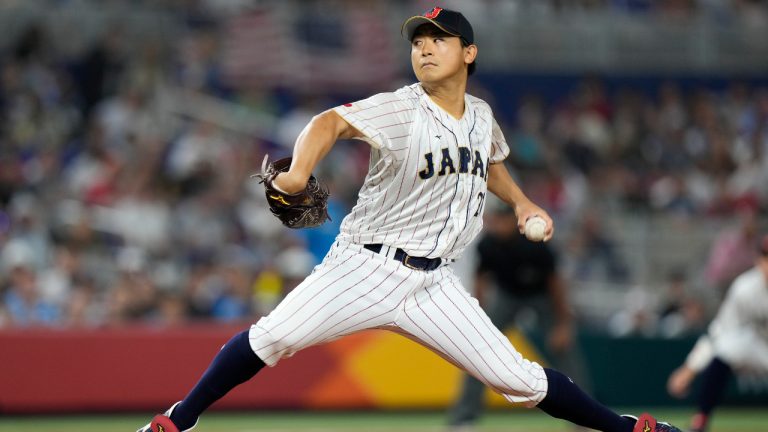 Japan pitcher Shota Imanaga (21) throws during first inning of a World Baseball Classic championship game against the United States, Tuesday, March 21, 2023, in Miami. (Wilfredo Lee/AP) 