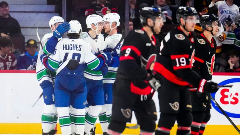 Vancouver Canucks right wing Ilya Mikheyev (65), third left, celebrates a goal with teammates while taking on the Ottawa Senators during third period NHL hockey action in Ottawa on Thursday, Nov. 9, 2023. (CP)