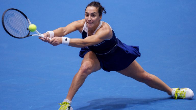 Italy's Martina Trevisan returns the ball against Slovenia's Kaja Juvan during the semifinal singles tennis match at the Billie Jean King Cup finals at La Cartuja stadium in Seville, southern Spain, Spain, Saturday, Nov. 11, 2023. (Manu Fernandez/AP) 