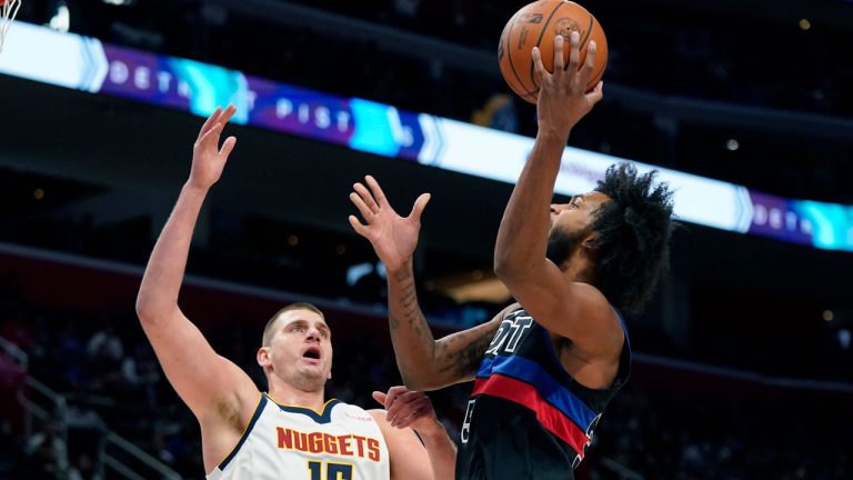 Detroit Pistons forward Marvin Bagley III (35) shoots over the defence of Denver Nuggets centre Nikola Jokic (15) during the first half of an NBA basketball game, Monday, Nov. 20, 2023, in Detroit. (Carlos Osorio/AP)