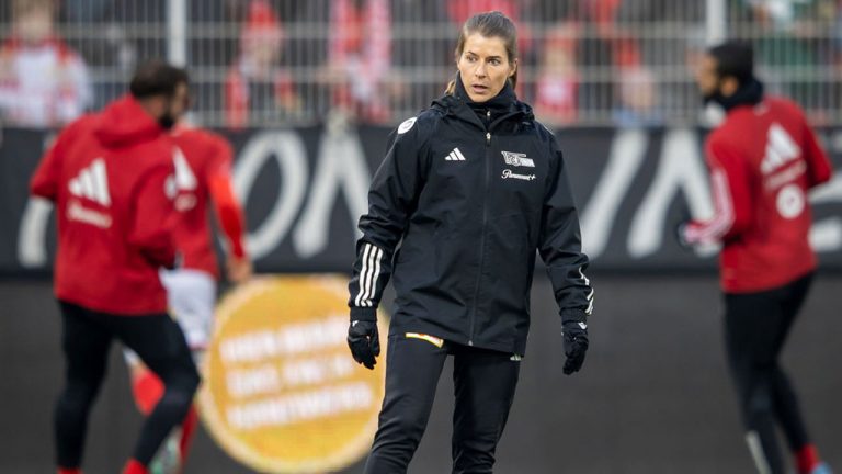 Berlin's assistant coach Marie-Louise Eta is on the pitch before the German Bundesliga soccer match between 1. FC Union Berlin and FC Augsburg in Berlin, Germany, Saturday, Nov. 25, 2023. (Andreas Gora/dpa via AP)