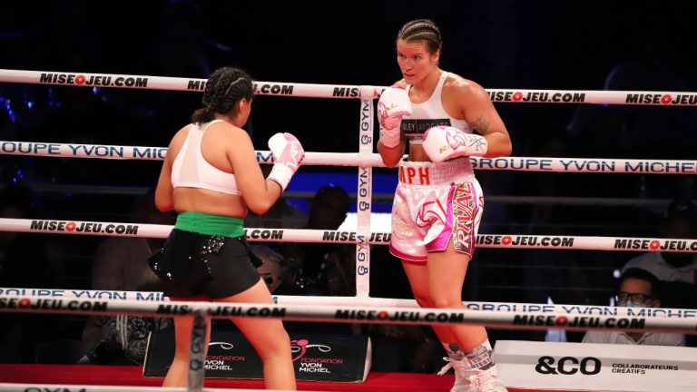 Jeanette Guadeloupe Zacarias Zapata (left) faces Marie-Pier Houle in a welterweight fight at the stade IGA, Montréal, Saturday, August 28 2021. A Quebecer coroner says Mexican boxer Zapata did not disclose a likely prior concussion before an August 2021 match in Montreal that led to her death. (CP/HO-GYM-Yannick Maltais)
