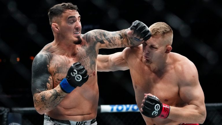 England's Tom Aspinall, left, punches Russia's Sergei Pavlovich during the first round of a heavyweight title bout at the UFC 295 mixed martial arts event Saturday, Nov. 11, 2023, in New York. (Frank Franklin II/AP)