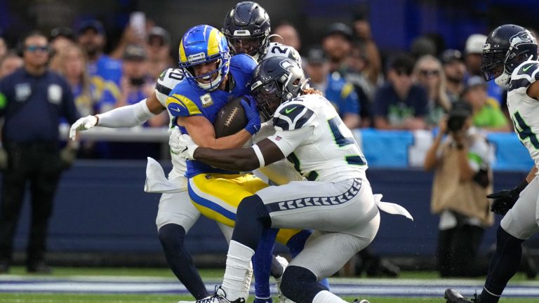 Los Angeles Rams wide receiver Cooper Kupp, left, is tackled while running the ball during the first half of an NFL football game Sunday, Nov. 19, 2023, in Inglewood, Calif. (Mark J. Terrill/AP)