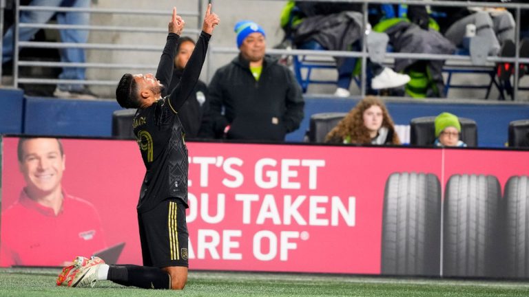 Los Angeles FC forward Denis Bouanga points skyward after scoring against the Seattle Sounders during the first half of an MLS conference semifinal playoff soccer match Sunday, Nov. 26, 2023, in Seattle. (Lindsey Wasson/AP Photo)