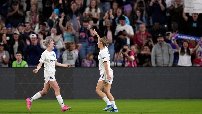 NJ/NY Gotham forward Esther Gonzalez, right, celebrates with teammate forward Jenna Nighswonger after scoring a goal during the first half of the NWSL Championship soccer game against OL Reign, Saturday, Nov. 11, 2023, in San Diego. (Gregory Bull/AP)