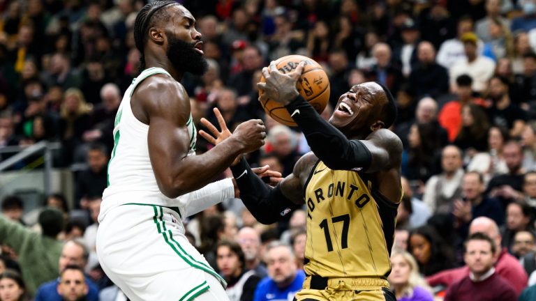 Toronto Raptors guard Dennis Schroder (17) is pressured by Boston Celtics guard Jaylen Brown (7) during first half NBA basketball action in Toronto on Friday, November 17, 2023. (Christopher Katsarov/CP)