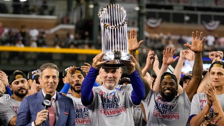 Texas Rangers manager Bruce Bochy holds up the trophy after Game 5 of the baseball World Series against the Arizona Diamondbacks Wednesday, Nov. 1, 2023, in Phoenix. The Rangers won 5-0 to win the series 4-1. (Brynn Anderson/AP)