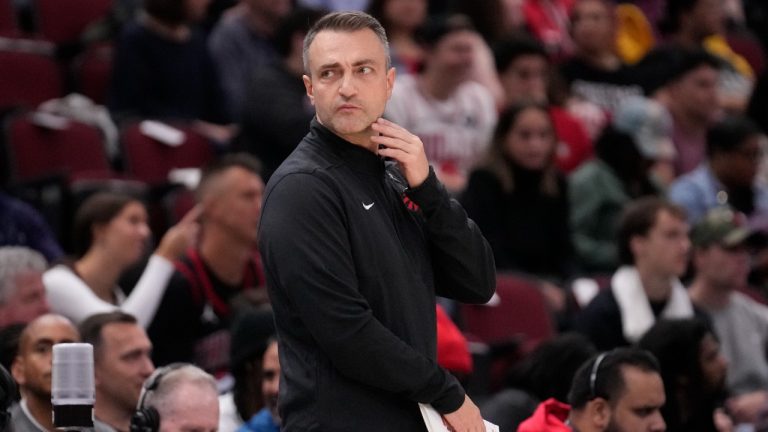 Toronto Raptors head coach Darko Rajaković looks to the bench during an NBA basketball game. (AP)
