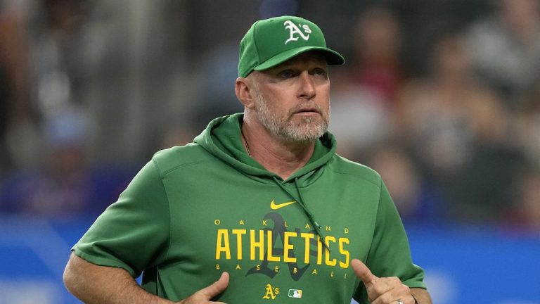 FILE - Oakland Athletics manager Mark Kotsay jogs to the dugout after checking on an injured player during a baseball game against the Texas Rangers, Sunday, Sept. 10, 2023, in Arlington, Texas. (Tony Gutierrez/AP)