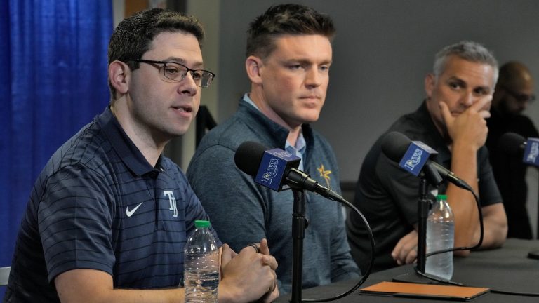 Peter Bendix, left, Tampa Bay Rays Senior Vice President of Baseball Operations & General Manager, sits with Erik Neander President of Baseball Operations, center, and manager Kevin Cash, right, take part in a season ending baseball news conference Monday, Oct. 9, 2023, in St. Petersburg, Fla. (Chris O'Meara/AP)