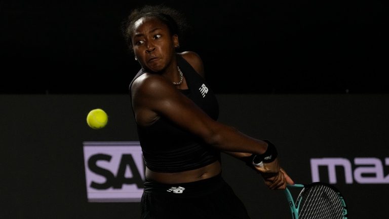 Coco Gauff of the United States returns a shot to Marketa Vondrousova, of the Czech Republic, during a women's singles match at the WTA Finals tennis championships, in Cancun, Mexico, Friday, Nov. 3, 2023. (Fernando Llano/AP)