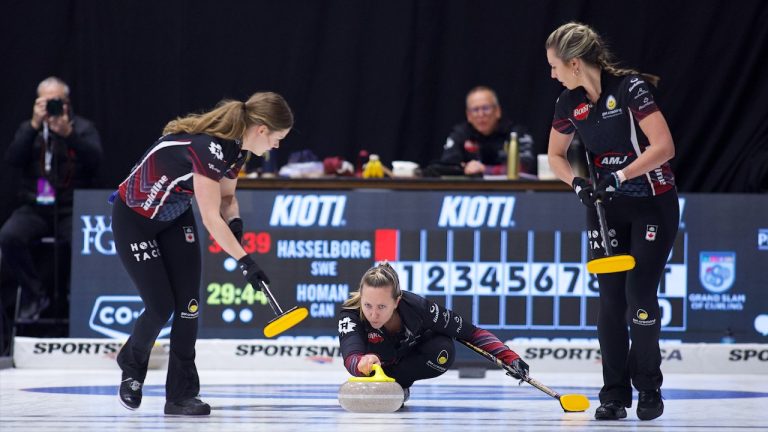 Rachel Homan (centre) shoots a stone during the KIOTI National on Friday, Nov. 10, 2023, in Pictou County, N.S. (Anil Mungal/GSOC)