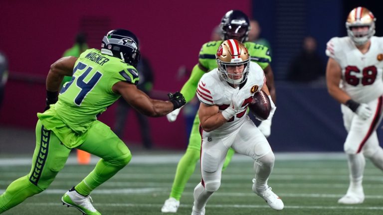 San Francisco 49ers running back Christian McCaffrey (23) is chased by Seattle Seahawks linebacker Bobby Wagner (54) during the first half of an NFL football game, Thursday, Nov. 23, 2023, in Seattle. (Stephen Brashear/AP)