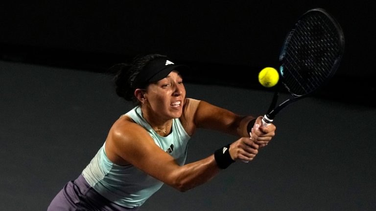 Jessica Pegula, of the United States, returns a shot to Coco Gauff of the United States, during a women's singles semifinal match at the WTA Finals tennis championships, in Cancun, Mexico, Saturday, Nov. 4, 2023. (Fernando Llano/AP)