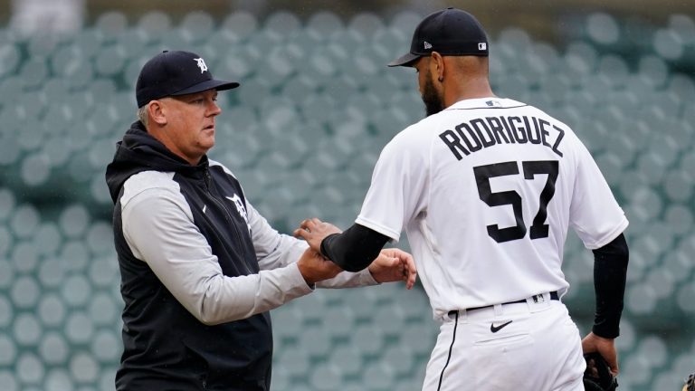 Detroit Tigers manager AJ Hinch takes the ball from pitcher Eduardo Rodriguez (57) in the fourth inning of a baseball game against the Boston Red Sox in Detroit, Wednesday, April 13, 2022. (Paul Sancya/AP Photo)