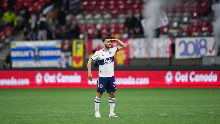 Vancouver Whitecaps' Russell Teibert salutes as he celebrates his goal against Valour FC during the first half of a preliminary round Canadian Championship soccer match, in Vancouver, on Wednesday, May 11, 2022. (Darryl Dyck/CP)
